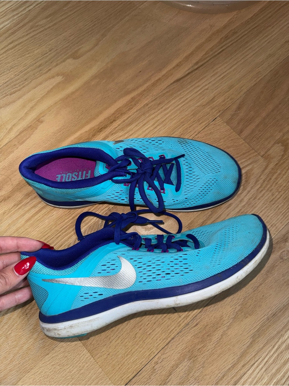 Nike Women's Blue Running Shoes with Purple Accents